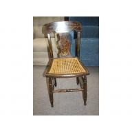 Very decorative early wooden chair with wicker seat