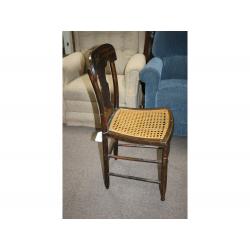 Very decorative early wooden chair with wicker seat